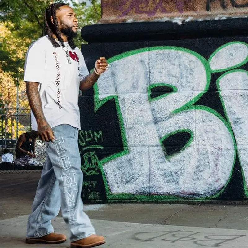 Burna Boy outfit in Wu-Tang Clan, Tommy Hilfiger, and Timberland, 2023