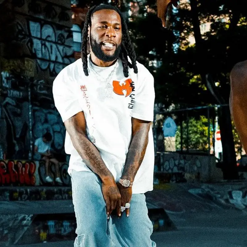 Burna Boy outfit in Wu-Tang Clan, Tommy Hilfiger, and Timberland, 2023