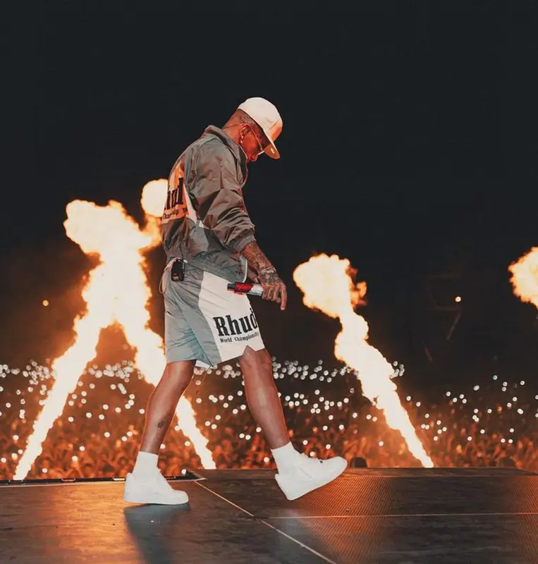 Sfera Ebbasta outfit in Rhude, Nike, and New Era, 2023