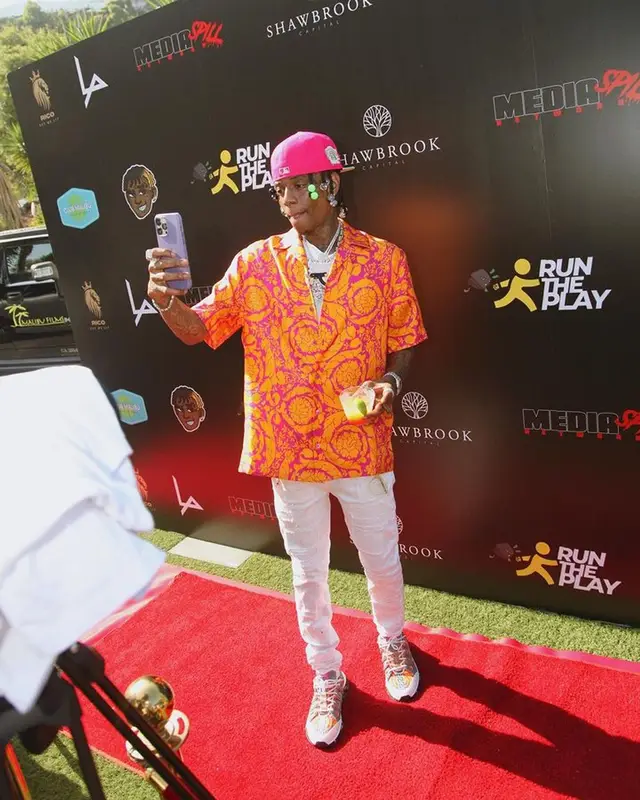 Soulja Boy outfit in Versace and Purple Brand, 2023