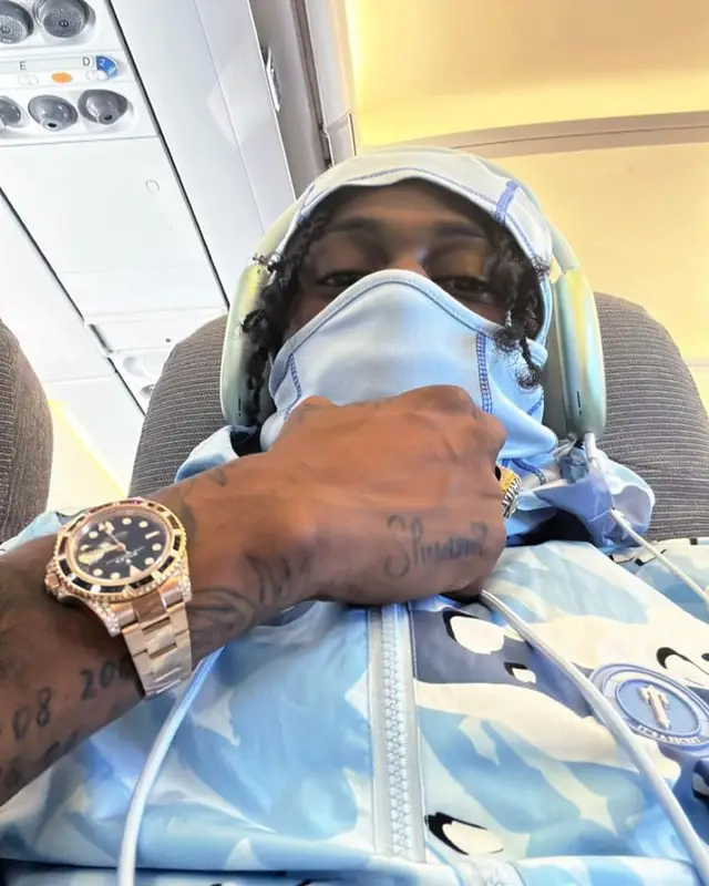 Russ Millions outfit in Trapstar, Louis Vuitton, and Gucci, 2023
