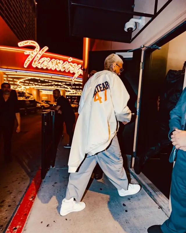 Chris Brown outfit in Dior, Vintage, and Denim Tears, 2023