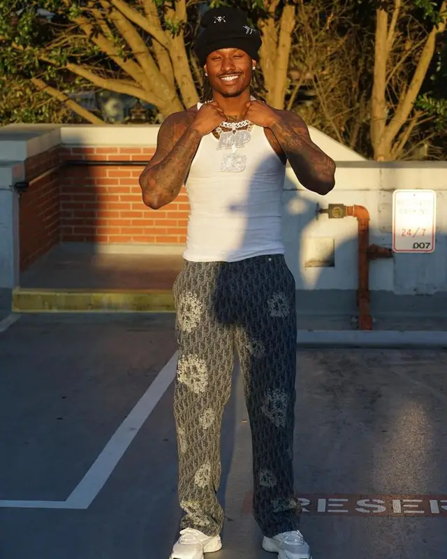 Duke Dennis outfit in Dior, Louis Vuitton, and Denim Tears, 2023