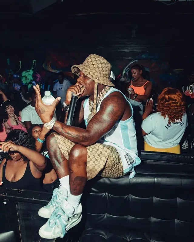 DaBaby outfit in Mitchell & Ness, Lanvin, and Gucci, 2023