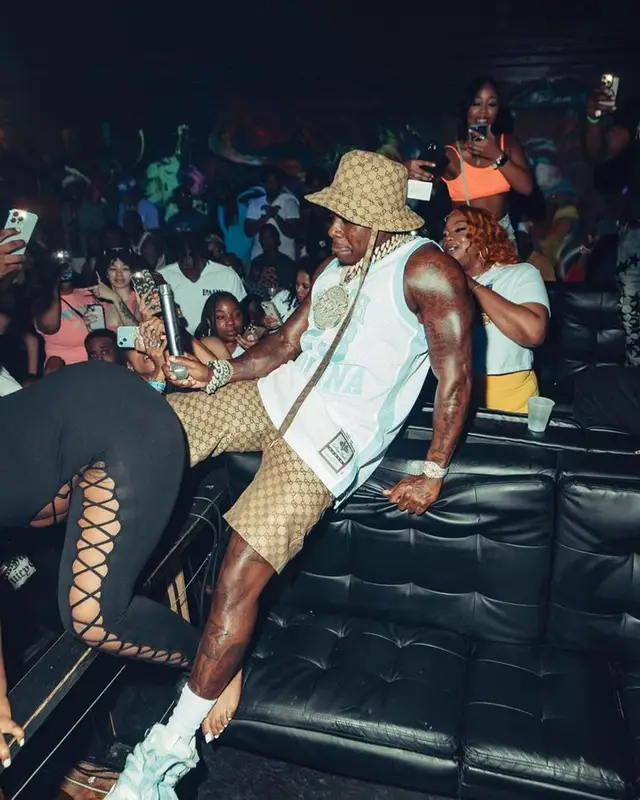 DaBaby outfit in Mitchell & Ness, Lanvin, and Gucci, 2023