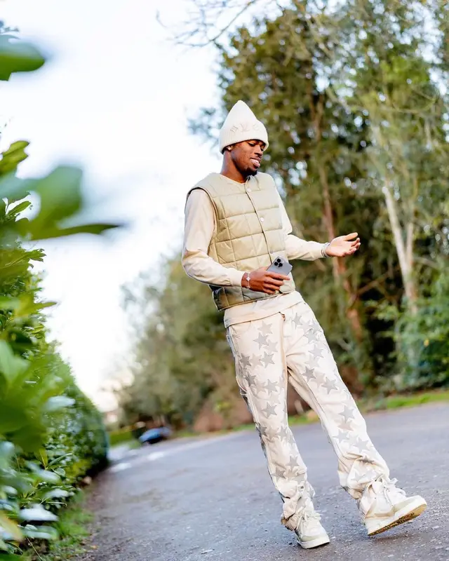 Carney Chukwuemeka outfit in Bottega Veneta, Amiri, and Louis Vuitton, 2023