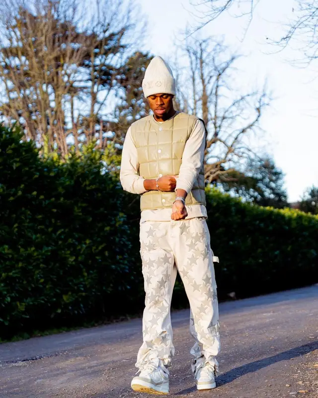 Carney Chukwuemeka outfit in Bottega Veneta, Amiri, and Louis Vuitton, 2023