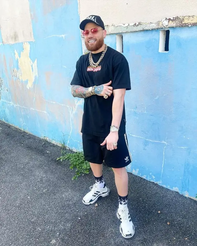 Miky Woodz outfit in Palm Angels, Adidas, and Balenciaga, 2023
