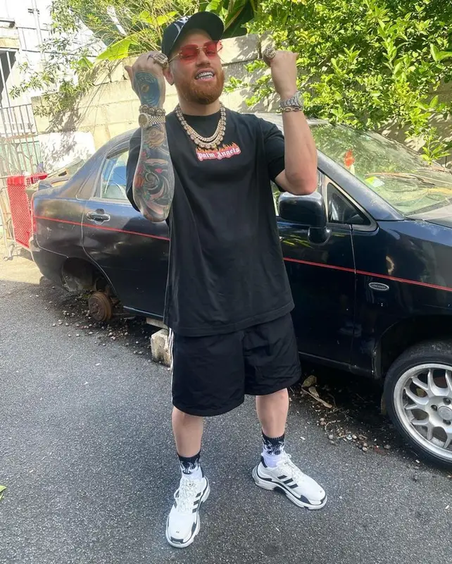 Miky Woodz outfit in Palm Angels, Adidas, and Balenciaga, 2023