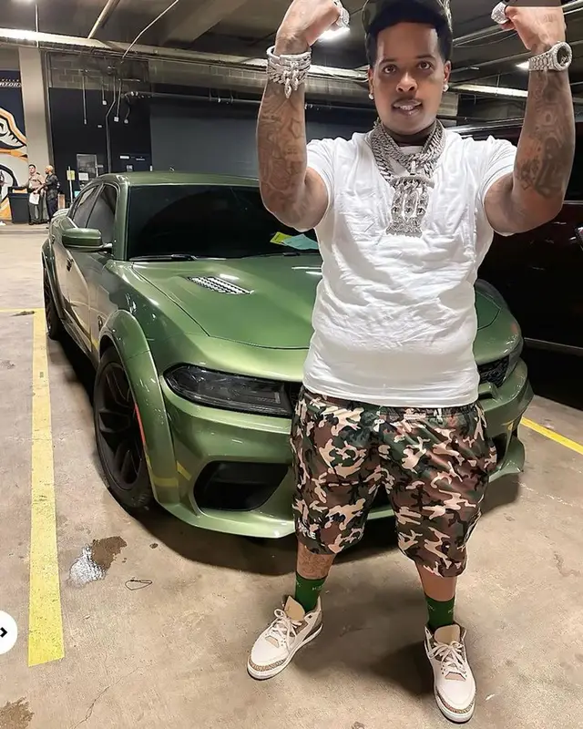 Finesse2tymes outfit in Purple Brand, Jordan, and Iceberg, 2023