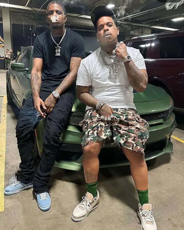 Finesse2tymes outfit in Purple Brand, Jordan, and Iceberg, 2023