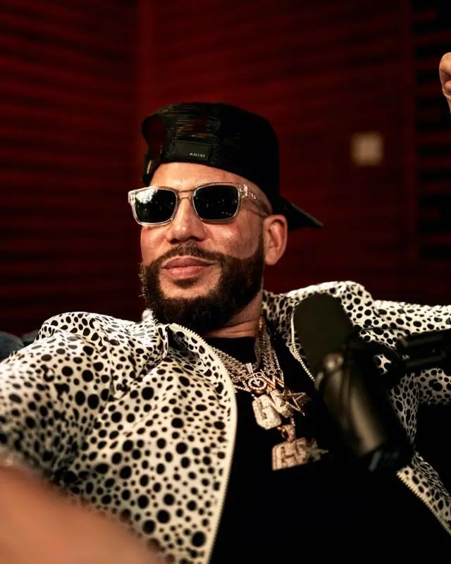 DJ Drama outfit in Louis Vuitton, Dior, and Amiri, 2023