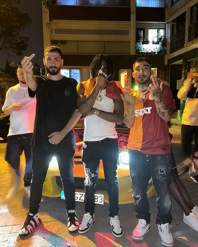 Russ Millions outfit in Polo Ralph Lauren, Amiri, and Louis Vuitton, 2023