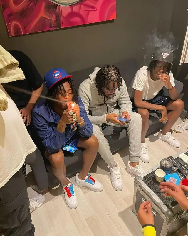 Russ Millions outfit in Louis Vuitton, Nike, and New Era, 2023