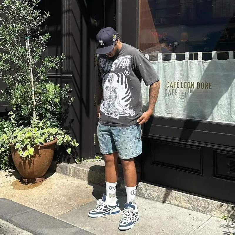 AJ Tracey outfit in Hellstar, Louis Vuitton, and New Era, 2023