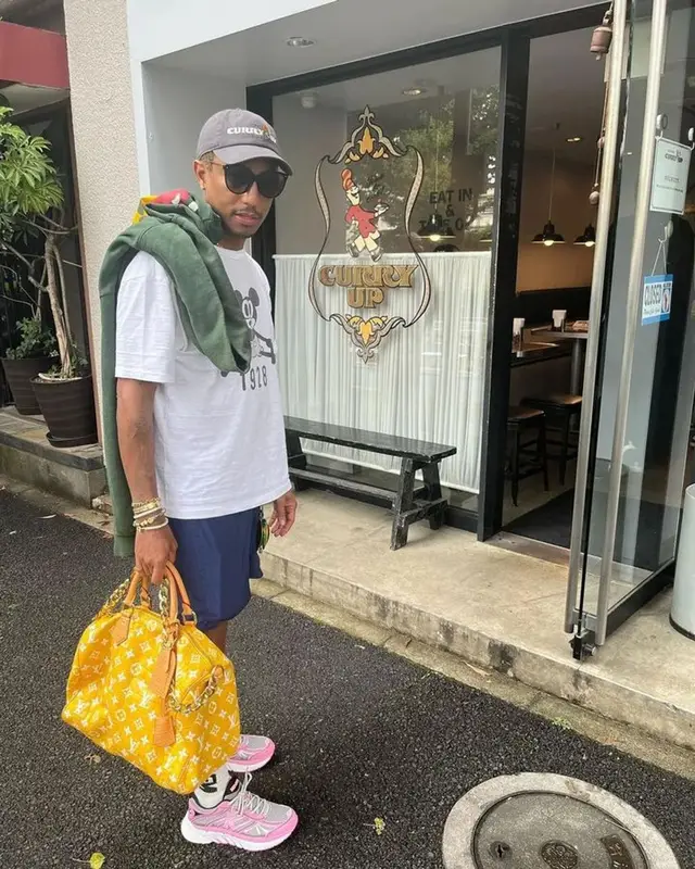 Pharrell Williams outfit in Human Made, Noah, and Louis Vuitton, 2023