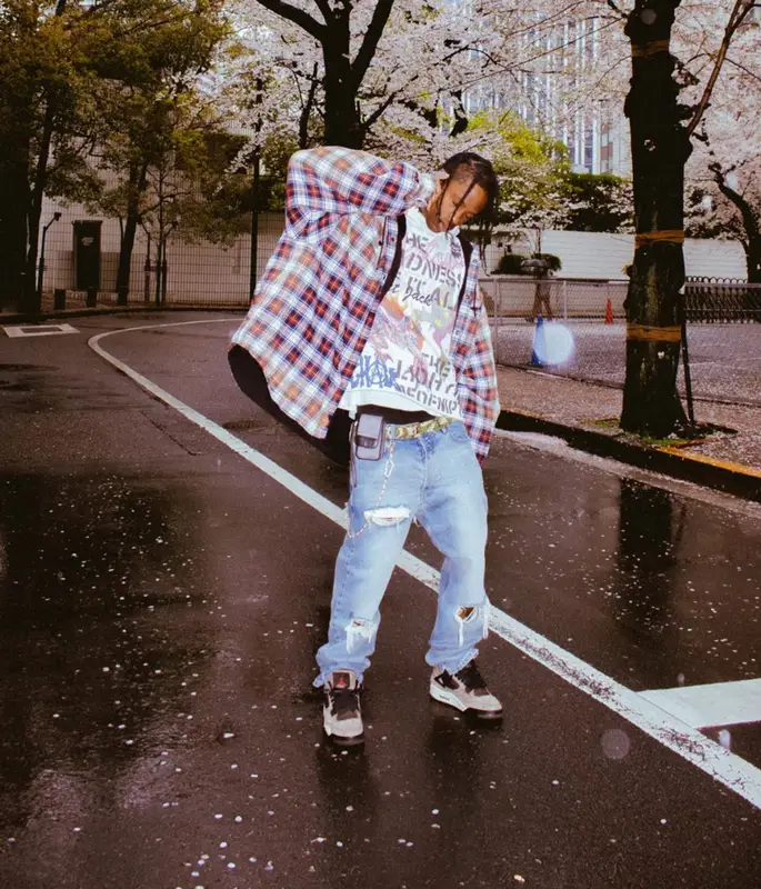 Travis Scott outfit in Balenciaga, Travis Scott Merch, and Louis Vuitton, 2023