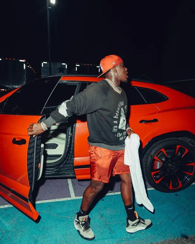 DaBaby outfit in Jordan, New Era, and Nike, 2023
