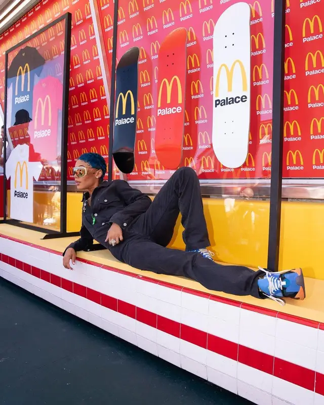 Coi Leray outfit in Palace, Adidas, and McDonald's Merch, 2023