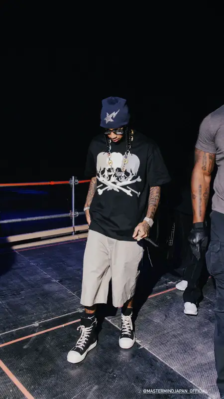 Tyga outfit in Mastermind, Prada, and Bape, 2023