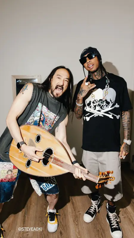 Tyga outfit in Mastermind, Prada, and Bape, 2023