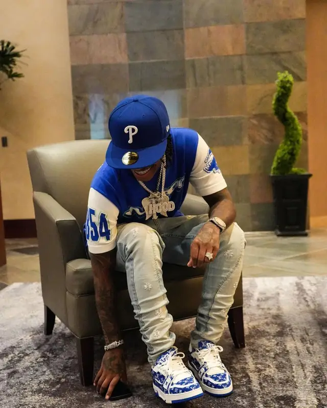 Lil Perfect outfit in Louis Vuitton, Serenede, and New Era, 2023