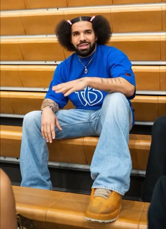 Drake outfit in Fubu, Acne Studios, and No Name, 2023