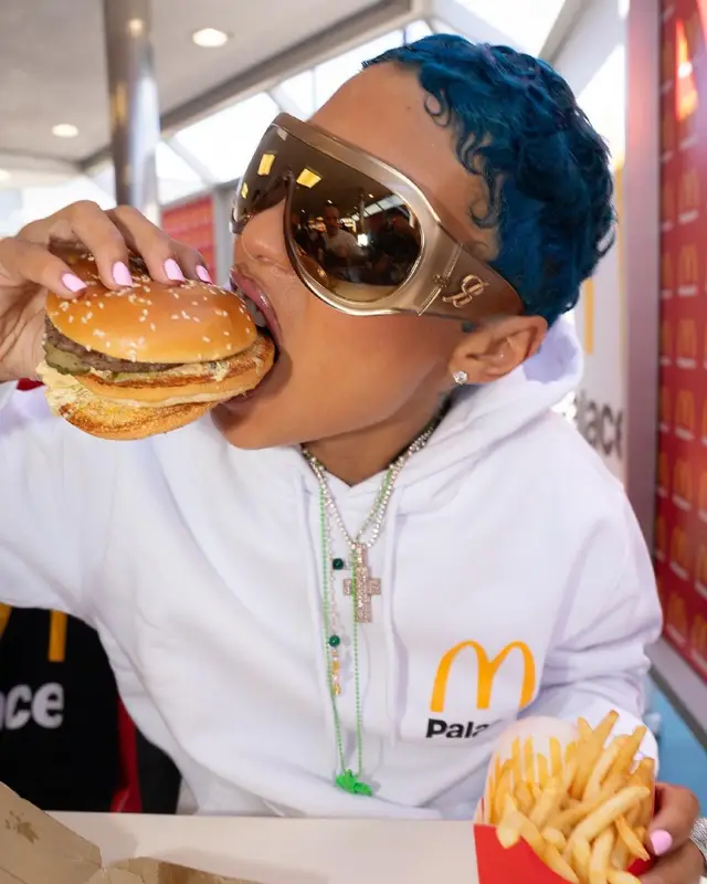 Coi Leray outfit in Palace, Adidas, and McDonald's Merch, 2023