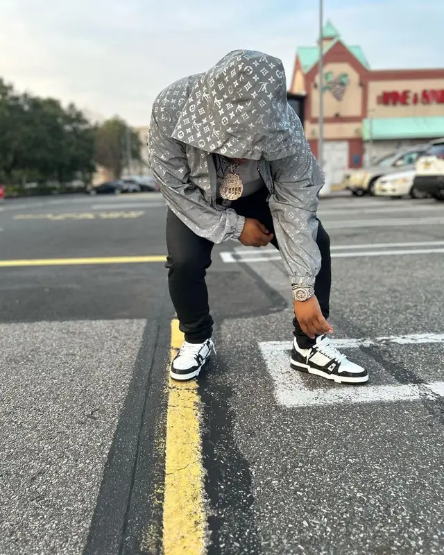 Don Q outfit in Louis Vuitton, Amiri, and Cartier, 2023
