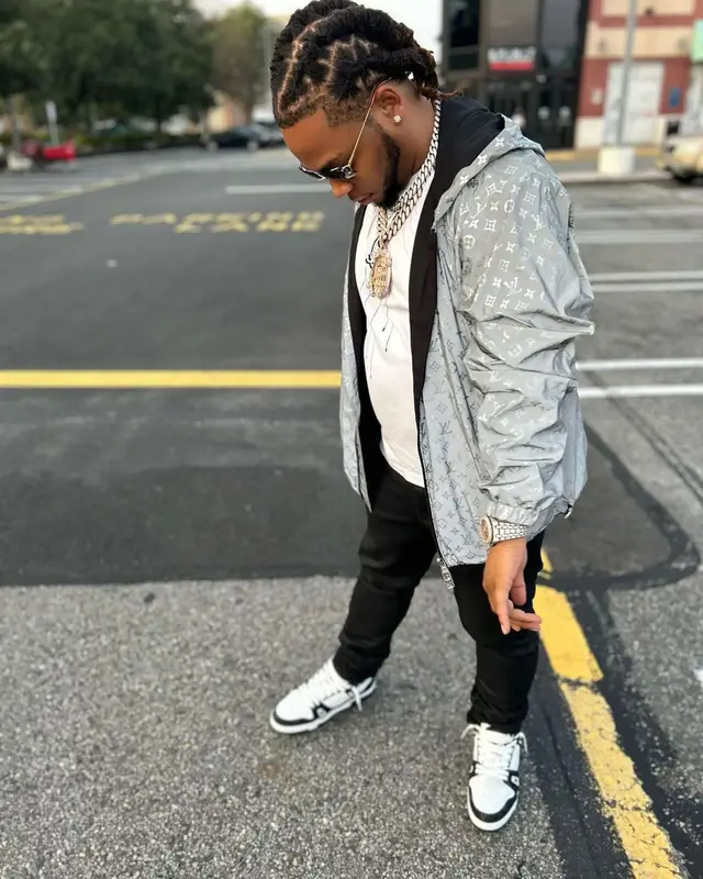 Don Q outfit in Louis Vuitton, Amiri, and Cartier, 2023