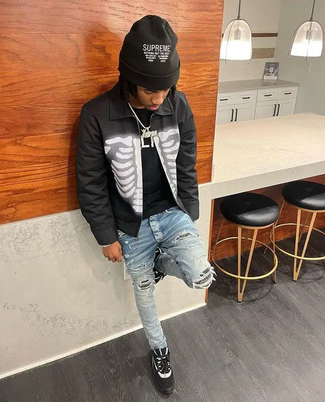 Lil Darius outfit in Celine, Amiri, and Supreme, 2023