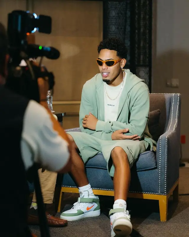 Myke Towers outfit in Helmut Lang, Nike, and Bottega Veneta, 2023