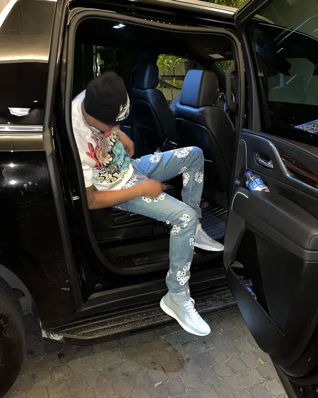 G Herbo outfit in Levi’s, Prada, and Denim Tears, 2023