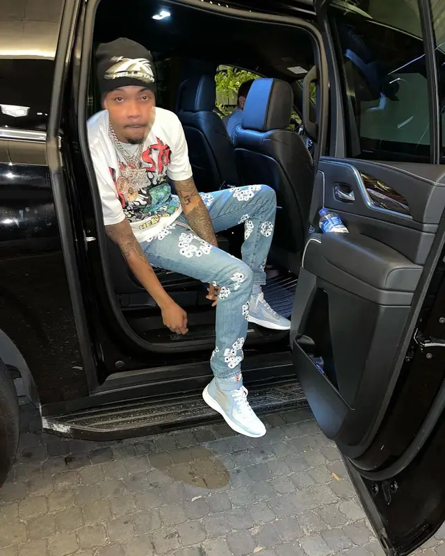 G Herbo outfit in Levi’s, Prada, and Denim Tears, 2023