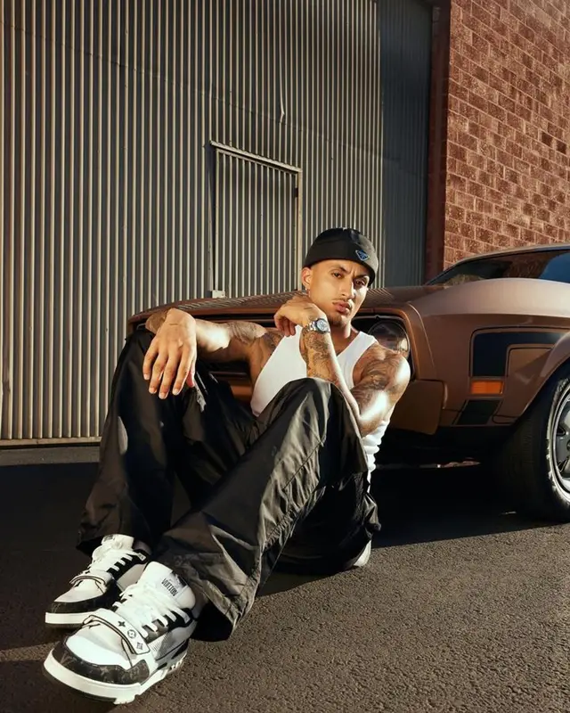 Kyle Kuzma outfit in Spencer Badu, Louis Vuitton, and Prada, 2023