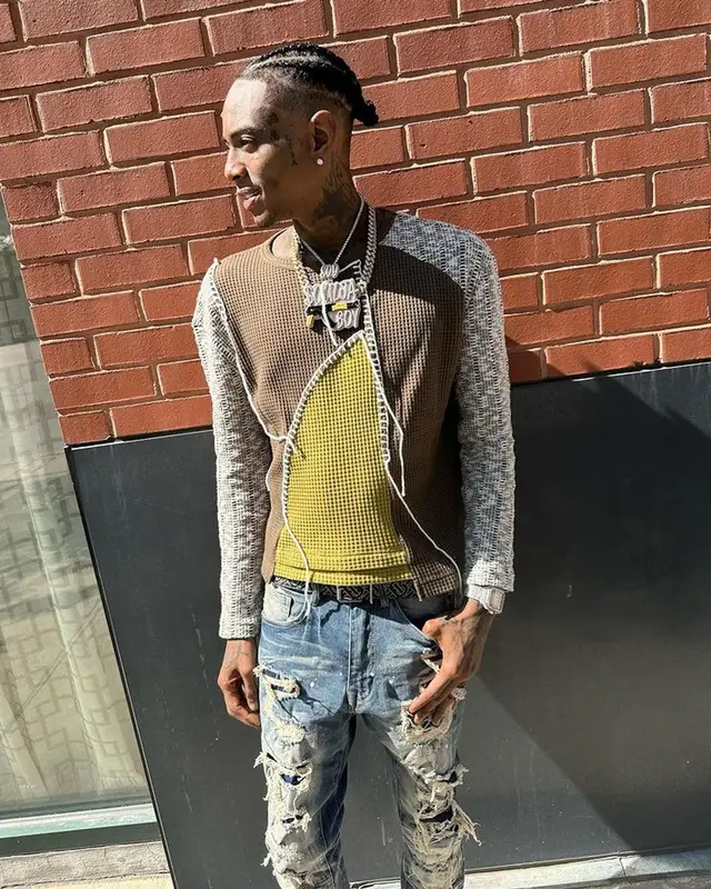 Soulja Boy outfit in Andersson Bell, Nike, and Burberry, 2023