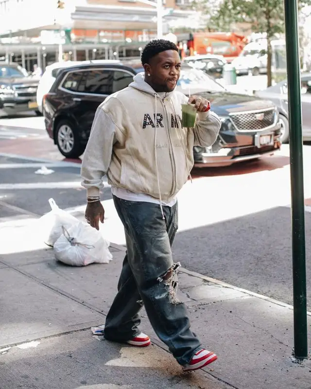 Mustard outfit in Balenciaga, Louis Vuitton, and Wilson, 2023