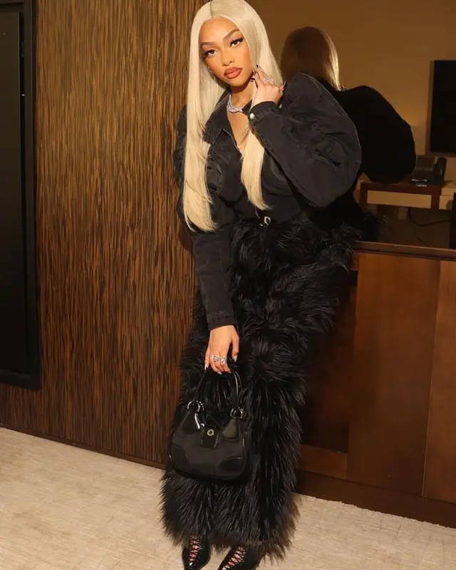 Jodie Woods outfit in Masha Popova, Prada, and Versace, 2023
