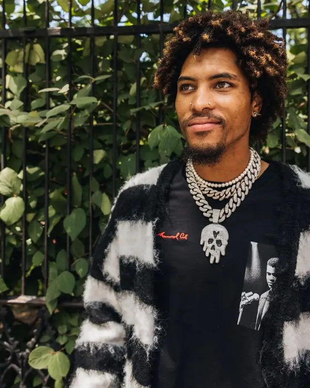 Kelly Oubre Jr outfit in Godspeed, DopeSoul, and Converse, 2023