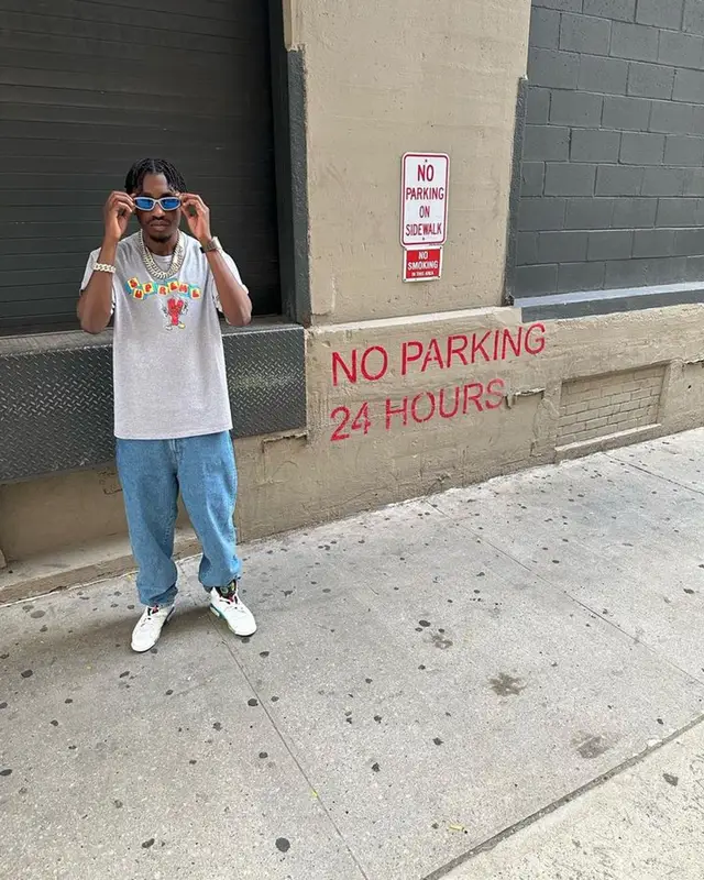 Lil Tjay outfit in Supreme, Coogi, and Jordan, 2023