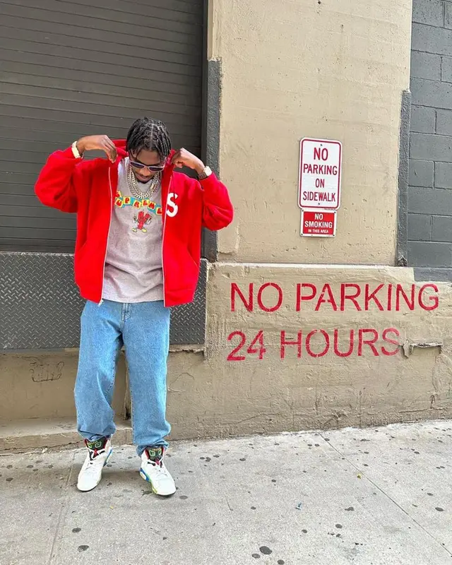 Lil Tjay outfit in Supreme, Coogi, and Jordan, 2023