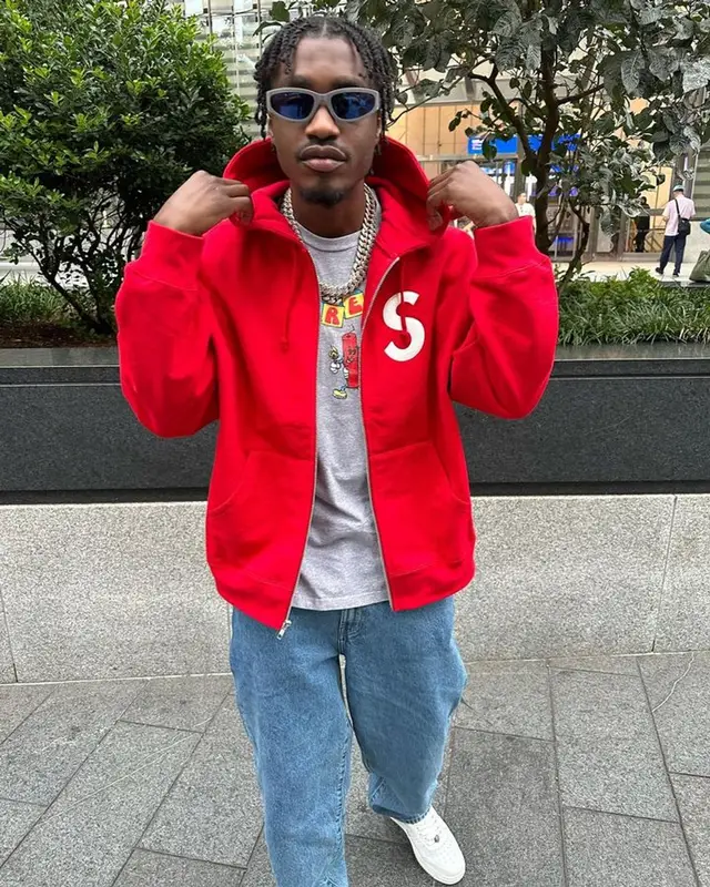 Lil Tjay outfit in Supreme, Coogi, and Jordan, 2023