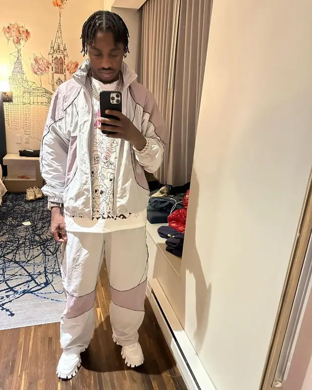 Lil Tjay outfit in Supreme and Prada, 2023
