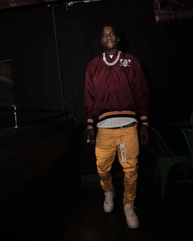 Soulja Boy outfit in Purple Brand, Nike, and Burberry, 2023