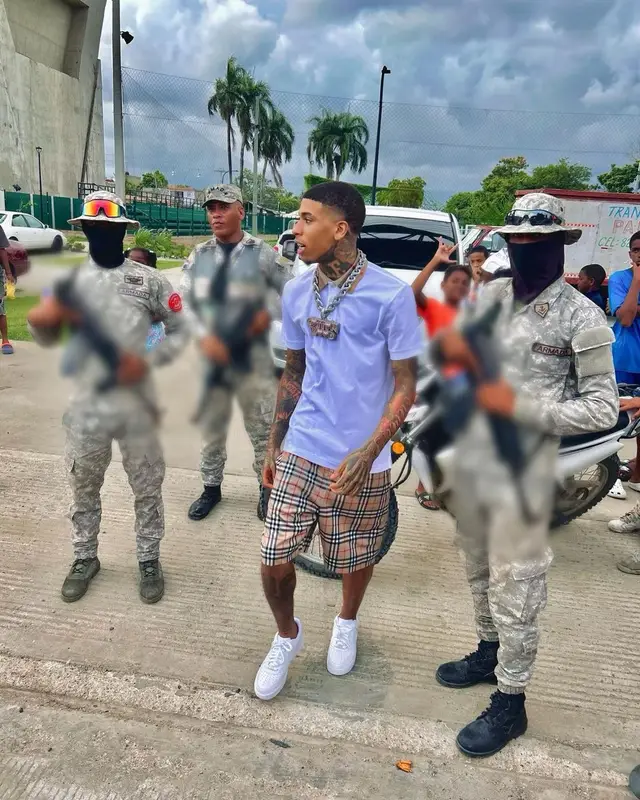NLE Choppa outfit in Burberry and Nike, 2023
