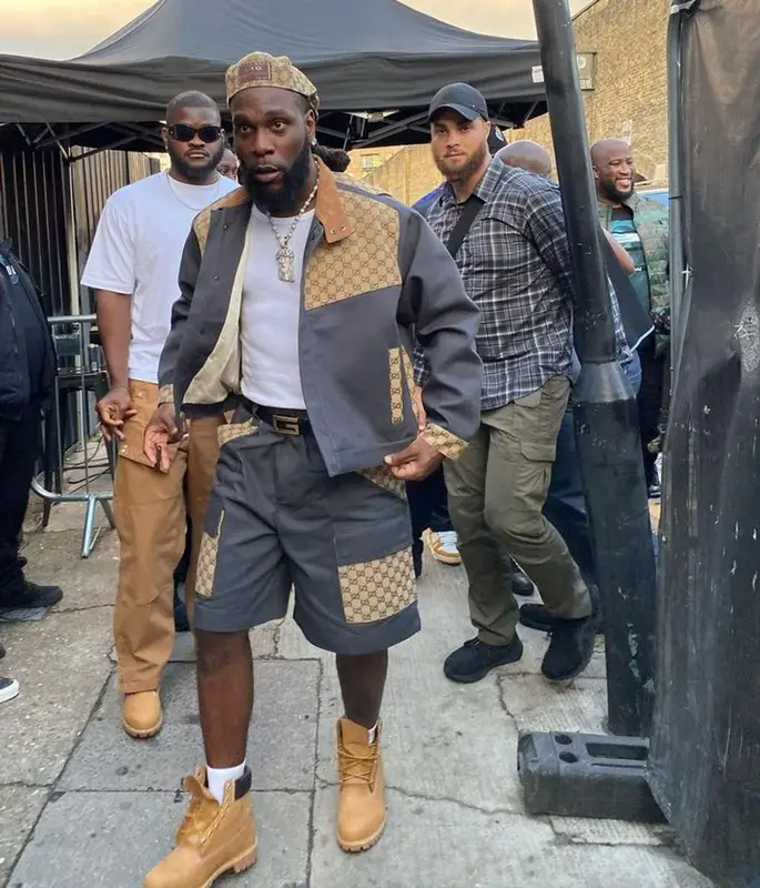 Burna Boy outfit in Timberland and Gucci, 2023