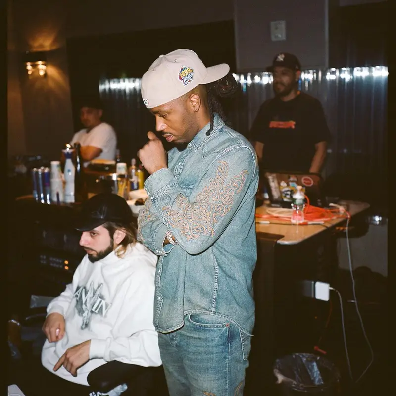 Metro Boomin outfit in Denim Tears, Levi’s, and New Era, 2023