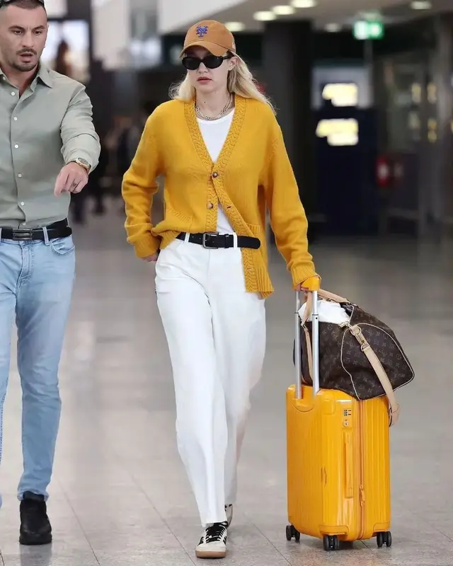 Gigi Hadid outfit in Louis Vuitton, Oliver Peoples, and Khaite, 2023