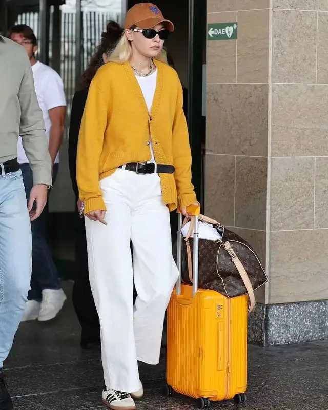 Gigi Hadid outfit in Louis Vuitton, Oliver Peoples, and Khaite, 2023