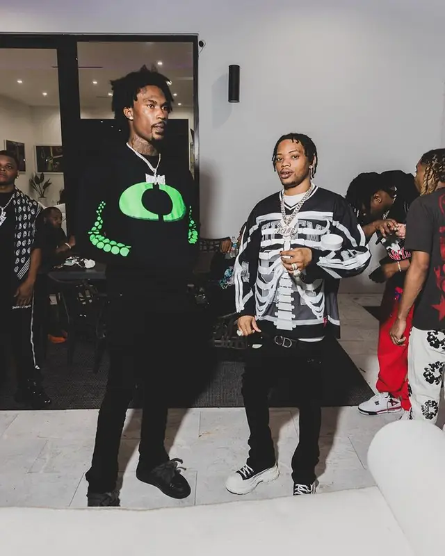 Lil Migo outfit in Supreme, Alexander McQueen, and Dior, 2023